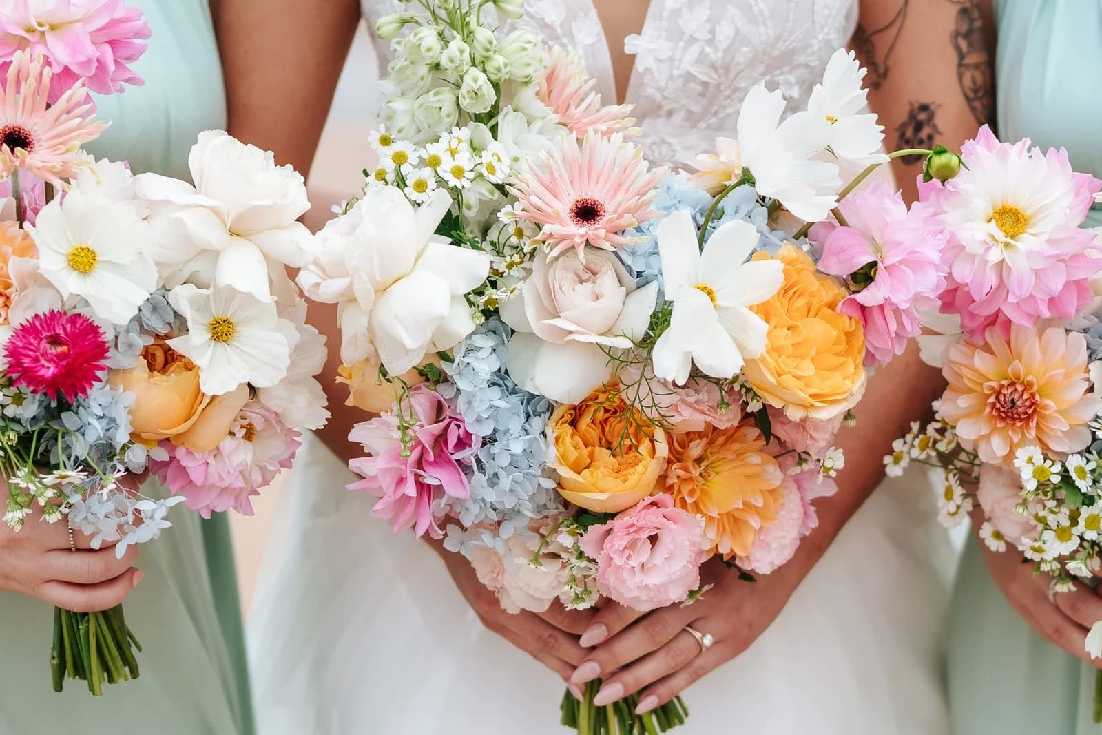 Bride holding a colourful bouquet