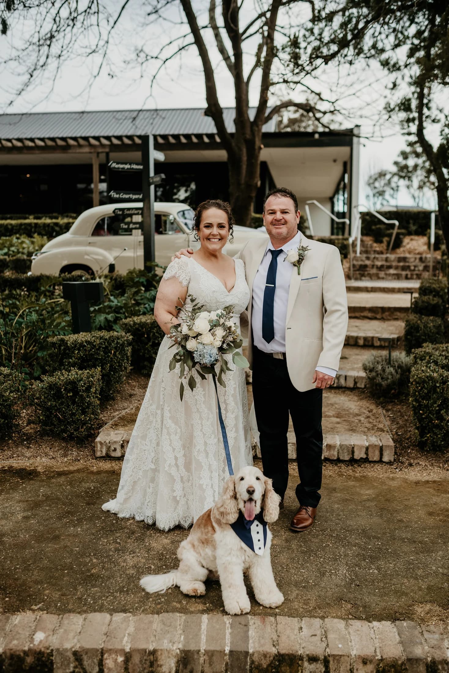 Couple laughing with their dog